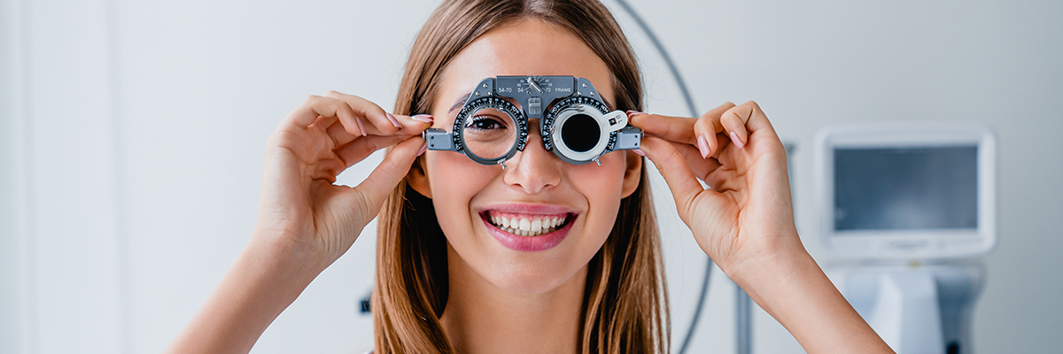 A woman using an eye-testing machine